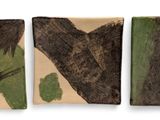 three pieces of wood with different designs on them on a white surface