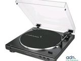 a close up of a turntable with a clear cover on it