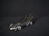 a toy car with a batmobile design on it