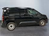 a picture of a black van parked in a garage