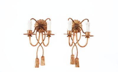 pair of antique brass wall sconces with tassels and candles