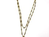 an image of a necklace with a clock on it on a white background