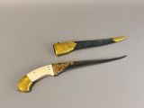 two knives that are sitting next to each other on a table