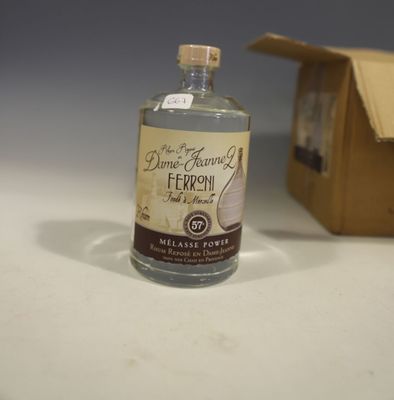 a bottle of alcohol sitting next to a small box