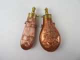 pair of antique copper perfume bottles with ornate designs on them