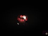 an image of a close up of a red diamond in the dark