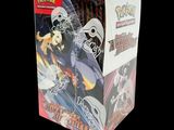 the box is full of pokemon trading cards with a skeleton on it