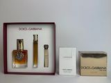 three different perfumes in a box on a table