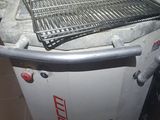 an image of a machine that has a grill on top of it