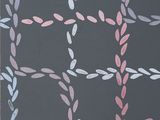 an image of a painting of a black background with pink and blue leaves