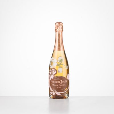 a bottle of champagne sitting on top of a table