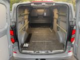 the back of a van with the doors open and the back door open