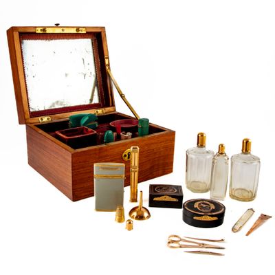 a wooden box with various items in it on a white background