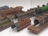 a lot of toy trains that are sitting on a table