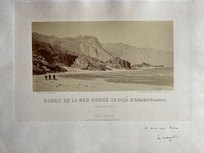 an old picture of a couple of people walking on the beach