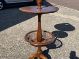 a wooden table with a basket on top of it