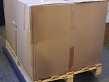 a large box sitting on a pallet in a warehouse