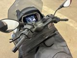 a close up of a motorcycle with a mirror on the back of it