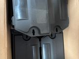 a cardboard box with a couple of pieces of plastic inside of it