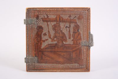 gravures sur le dos d'un livre en cuir muni d'une poignée en argent