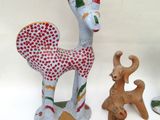 a group of ceramic figurines of animals and animals