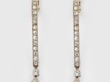 a pair of diamond and gold earrings