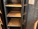 a refrigerator that has a lot of shelves inside of it