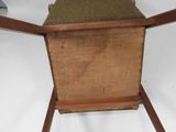 a chair with a seat made of wood and a seat made of burlock