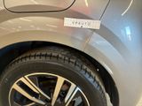 a close up of a car tire with a sticker on it