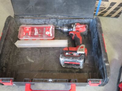two tools in a tool box on the floor