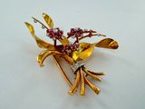 gold plated flower brooch with pink and white stones