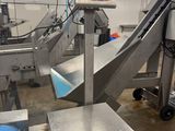 a picture of a machine that is working on a conveyor belt
