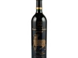 a bottle of red wine with a sheep design on it