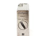 a silver lighter that is sitting on a white surface