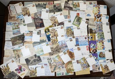 a table with a bunch of postcards on top of it