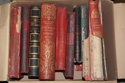 a box full of old books sitting on a table