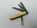 a swiss army knife with a yellow handle on a white surface