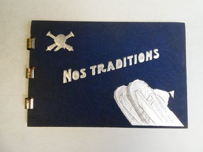 a blue book with a picture of a ship and a crossbone on it