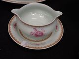 a bowl and saucer on a saucer on a black table
