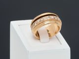 an image of a gold ring with diamonds on top of a white box