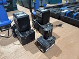 three electric tools are sitting on a table in front of a keyboard