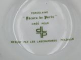 a white plate with a green and white design on it