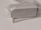 a piece of white paper wrapped in plastic on a table