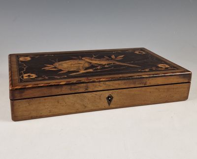 an image of a wooden box with a bird design on it
