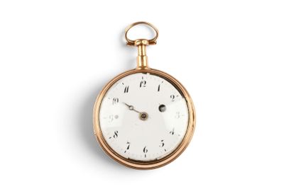 a gold pocket watch with roman numerals on the face