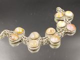 a picture of a bracelet that has a bunch of stones on it