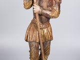 statue d'un homme tenant un bâton et accompagné d'un chien, sur fond blanc