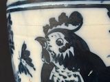 a black and white vase with a picture of a monkey on it