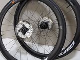 pair of wheels with spokes and spokes on a white surface