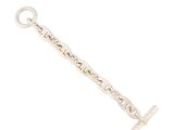a close up of a silver chain with a cross on it
